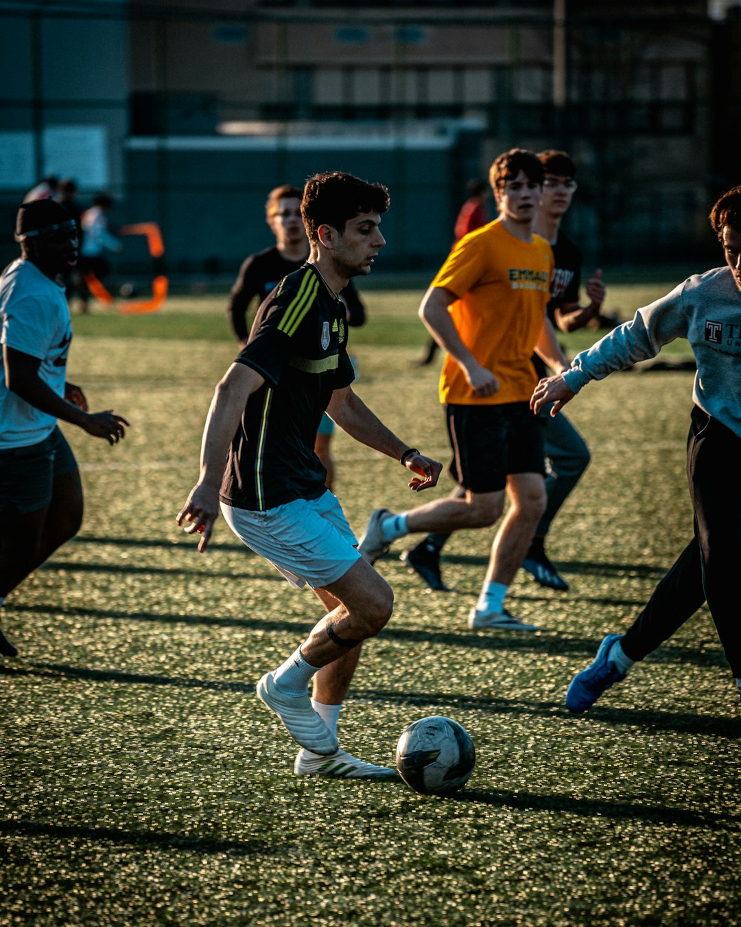 a-group-of-young-men-playing-a-game-of-soccer-lrxfcy6ck5i